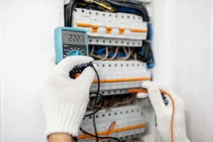 electrician in wheaton il testing an electrical panel